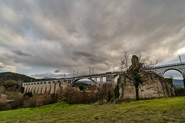 Destroyed in the Allied bombings of 1943, it was rebuilt in its current form. It is supported by two sets of arches separated by a large arch spanning the Carpino River.
