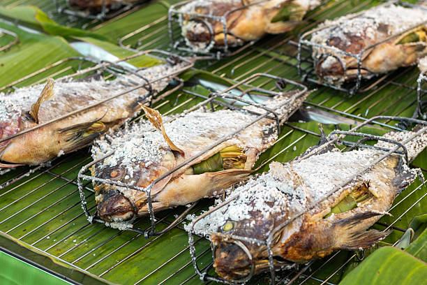 Grilling Salt-Crusted Fish on Banana Leaves, Thai Market