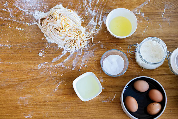 Homemade Pasta Preparation With Ingredients On Wooden Table