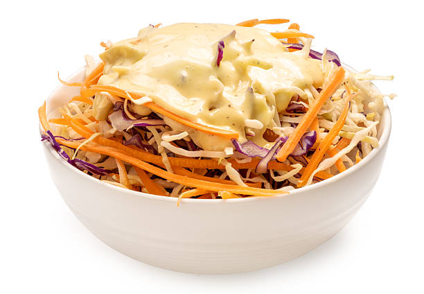 Mixed vegetable salad bowl, side dish, appetizer with salad cream isolate on white with clipping path.