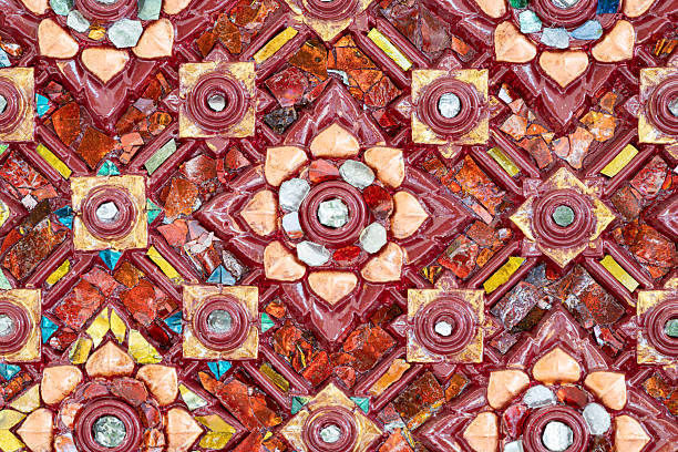 Elegant Thai decorative pattern with glass mosaic details producing a luxurious surface suitable for premium design and cultural backgrounds.