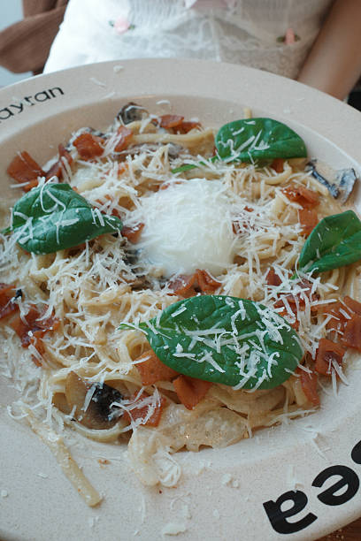 Fresh pasta with cheese, basil, and caramelized onions