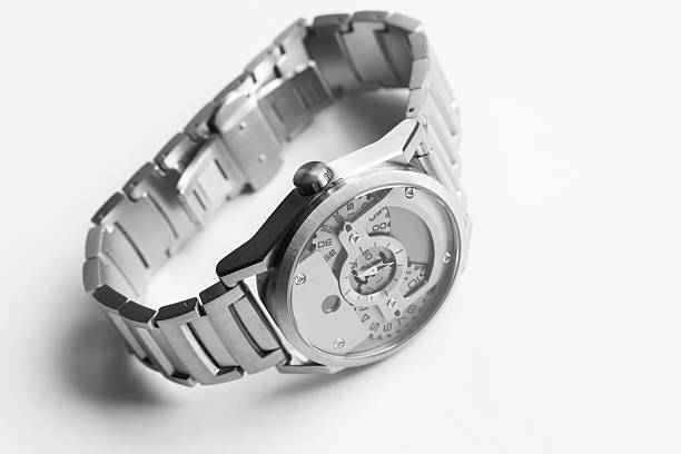 Mechanical wrist watch in satin finished steel case with a jumping hour disc