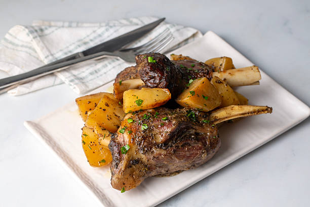 Slow Roasted Lamb Shank with Seasoned Potatoes and Herbs