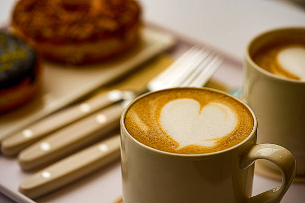 Cups of coffee decorated with a heart