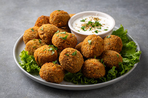 Traditional Middle Eastern Falafel Balls with Yogurt Dip and Lemon