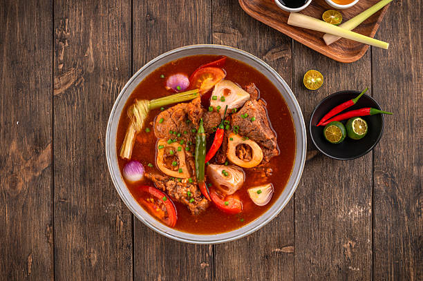 Kansi beef shank sour soup with bone marrow on wooden background