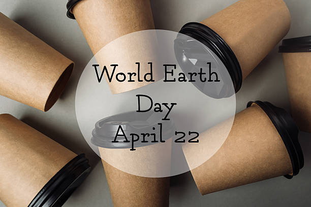 Disposable coffee cups are creatively arranged on a neutral surface, representing eco-conscious choices and the importance of sustainability in daily life