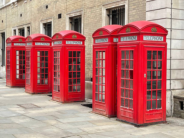 Generic UK telephone booths in Drury Lane are of Covent Garden , London UK