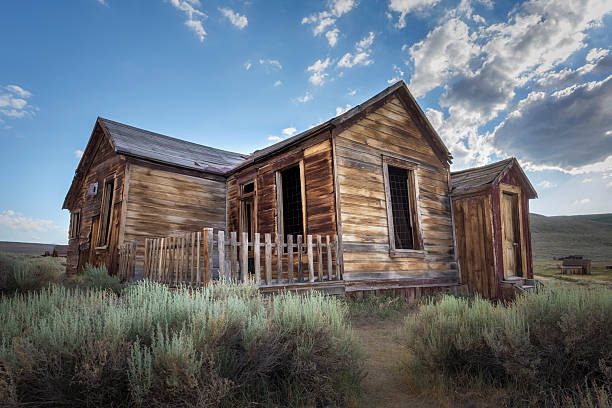 Abandoned house exterior with weathered wood siding in the Great Basin Desert, at Bodie State Historic Park, California
