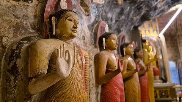 old rock monastery in Sri Lanka with buddha figures