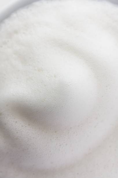 Milk Foam Macro Portrait — Soft Dome Fine Bubble Texture Cup