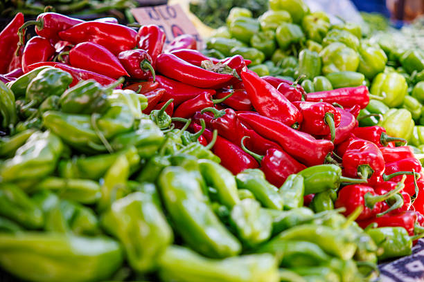 Fresh Red And Green Peppers At Outdoor Market