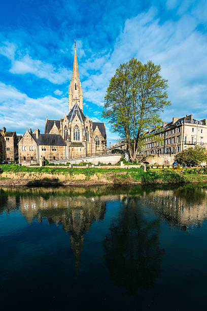St john the evangelist church reflecting in the river avon in bath