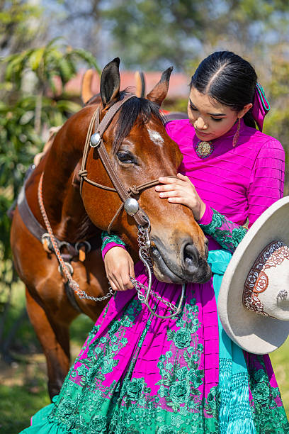 Cowgirl skirmish with her horse