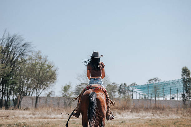 Cowgirl riding her horse