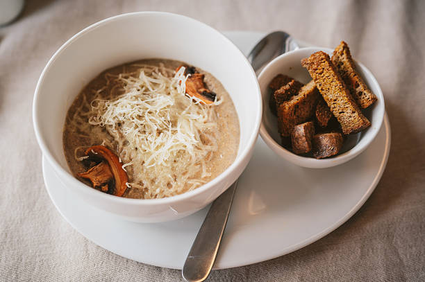Tasty Mushroom Soup with parmesan cheese and croutons