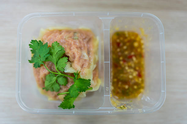 Steamed Dumplings Dim Sum in box with seafood dip
