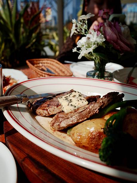 Plated steak with sauce and vegetables