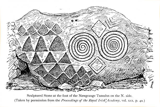 Detail of a sculpted stone found at the Newgrange megalithic passage tomb in Ireland. This stone is located at the foot of the Newgrange Tumulus on the North side. It is decorated with neolithic megalithic art, featuring a pattern of triangles, diamonds, and spirals.