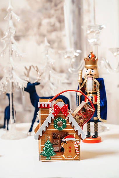 Whimsical Gingerbread House And Nutcracker With Icing Details And Candy Accents, Miniature Reindeer