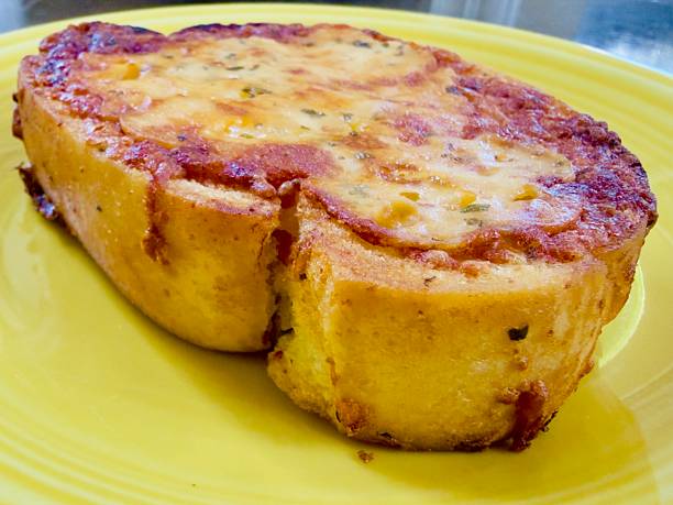 Cheesy Garlic Bread Slice with Golden Crust Close-Up