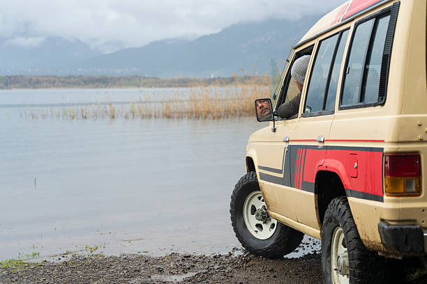 It’s time for an off-road adventure—an adventure enthusiast is exploring the flood-swamped streets after the storm as a weekend activity.