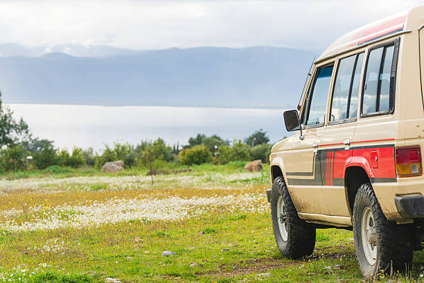 It’s time for an off-road adventure—an adventure enthusiast is exploring the flood-swamped streets after the storm as a weekend activity.