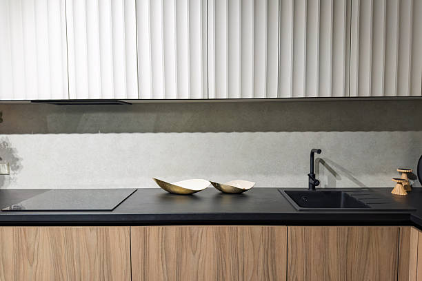 Modern kitchen design featuring elegant bowls on a stylish countertop and minimalist cabinets