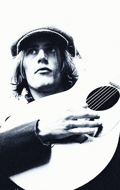 A quiet, introspective portrait echoing the poetic restraint of 1970s British pop and folk—where identity, sound, and solitude intertwine.