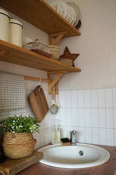 Cozy Kitchen Decor with Rustic Shelves, Dishware, and Elegant Baskets for a Homely Atmosphere