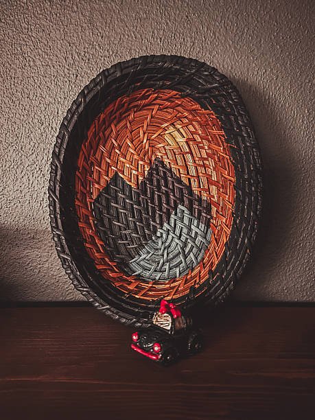 Handmade woven basket with mountain pattern and small toy car