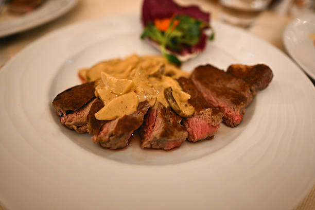 Sliced beef steak with mushroom cream sauce