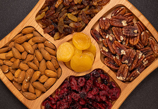 Healthy nuts and dried fruit snack mix on tray