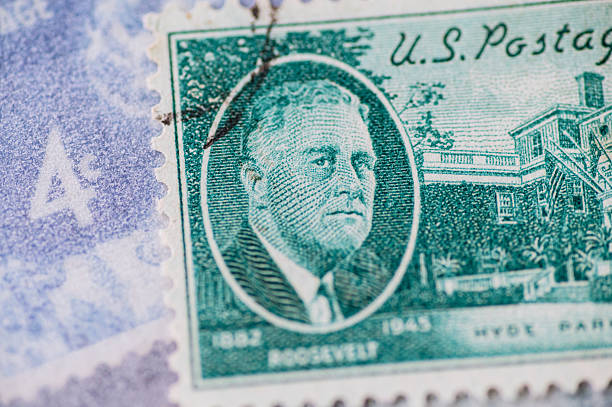 Close-up of United States postage stamp featuring Franklin D. Roosevelt portrait. Concept of American history, politics, leadership and presidency.