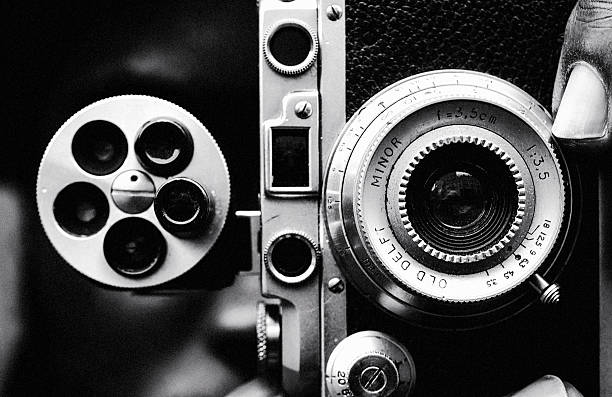 A striking black-and-white close-up of a vintage camera reveals the tactile beauty of analog engineering—metal textures, engraved lens markings, and mechanical complexity distilled into a study of vision, craftsmanship, and time.