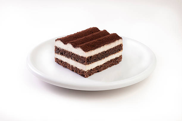 Tiramisu cake slice on a white plate