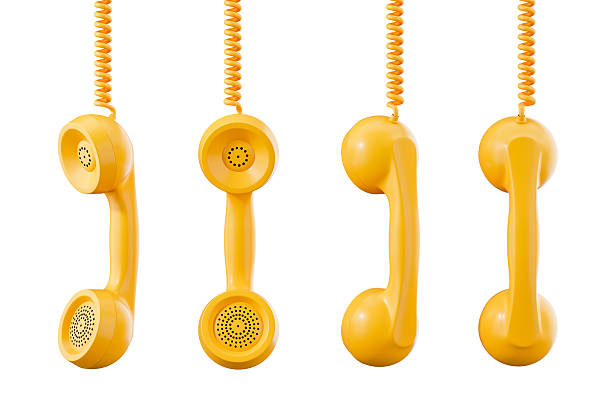 Four retro yellow telephone handsets hanging vertically with coiled cords, realistic 3D Rendering style, isolated on white background, concept of communication
