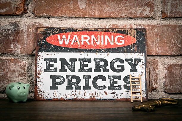 WARNING ENERGY PRICES text on sign highlighting increasing costs and economic pressure situation
