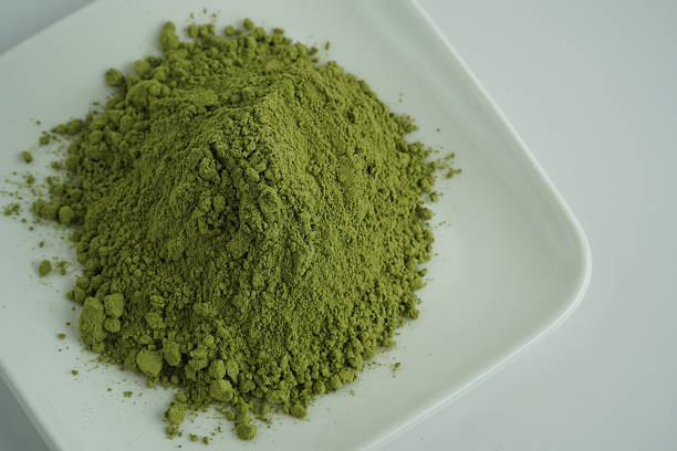 Vibrant Green Powder Heaped on a Pristine White Ceramic Plate