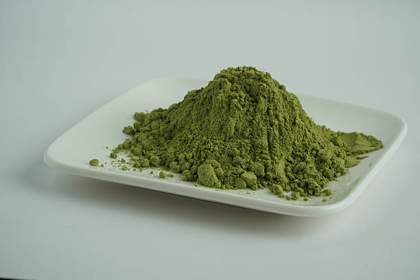 Vibrant Green Powder Piled on White Plate, Healthy Superfood Concept