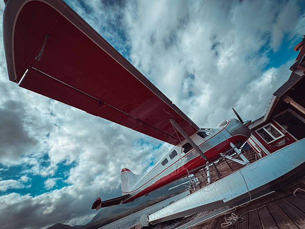 Alaskan Bush Plane Waiting for Passengers on a Scenic Mountain Lake Dock