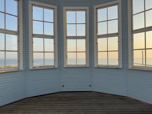 Empty interior of a light blue wooden room of a waterfront building at the ocean
