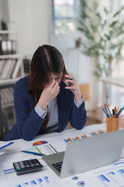 Stressed business woman talking on phone