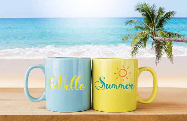 Hello summer on ceramic cup over tropical beach background