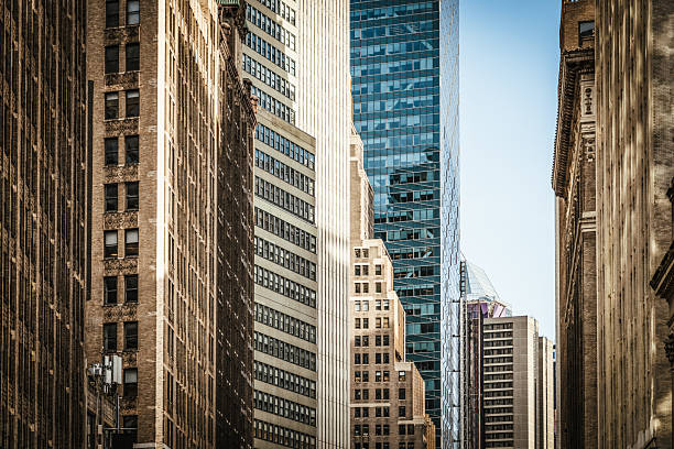 A perspective view showing architectural styles along rows of towers in Midtown Manhattan, New York City.