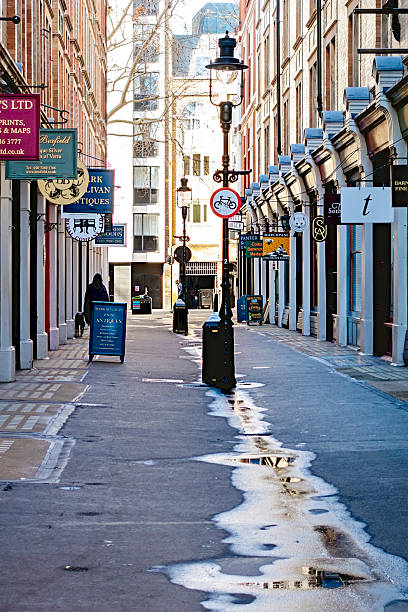 Cecil Court, a small but historic pedestrianised street off St Martin’s Lane in London’s West End. The Court is famous for its antiquarian book sellers, antique shops and art specialists as well as small shops selling such specialist collectables as coins, stamps, prints, jewellery, porcelain and maps.