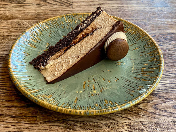 Slice of chocolate gateaux on a decorative plate