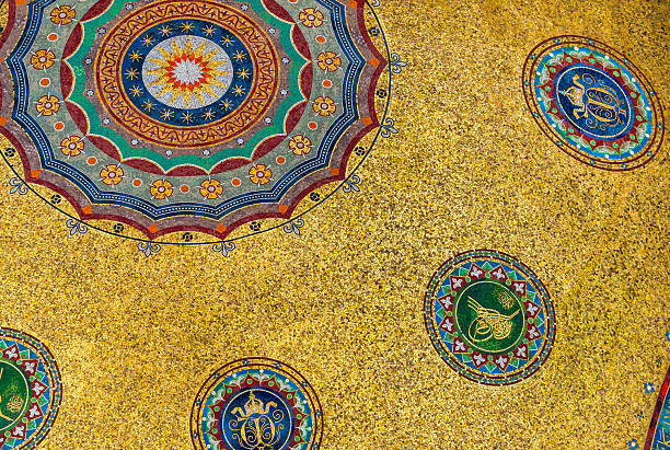 Vibrant golden mosaics cover the interior dome of the German Fountain, featuring intricate circular patterns in blue, green, and red. The central design is a large stylized flower or sun medallion.