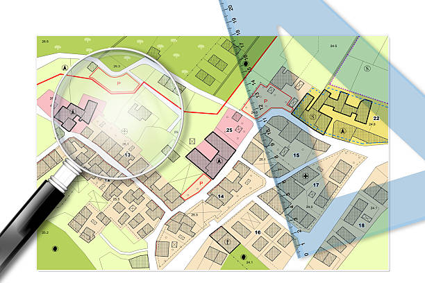 Plastic set square and magnifying glass over an imaginary General Urban Plan - 3D render concept image with copy space - note: the map is totally invented and does not represent any real place Plastic set square and magnifying glass over an imaginary General Urban Plan - 3D render concept image with copy space - note: the map is totally invented and does not represent any real place ground plan stock illustrations